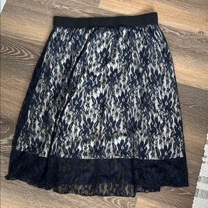 XL Elegant Navy Lace Skirt with elastic waist and nude lining.